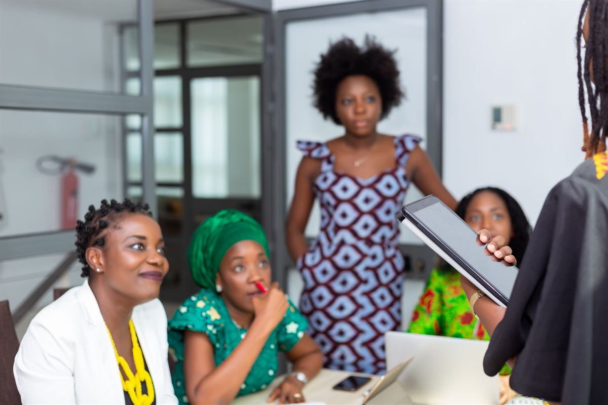 Team of African women collaborating in an office meeting