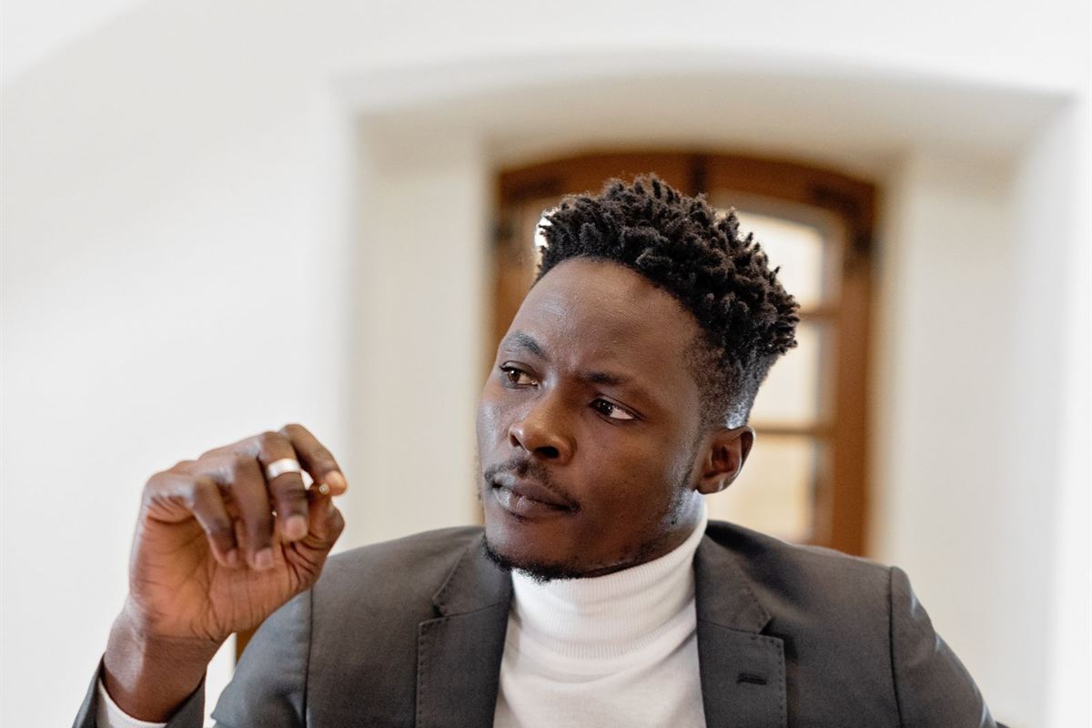 African business consultant using a tablet at his desk