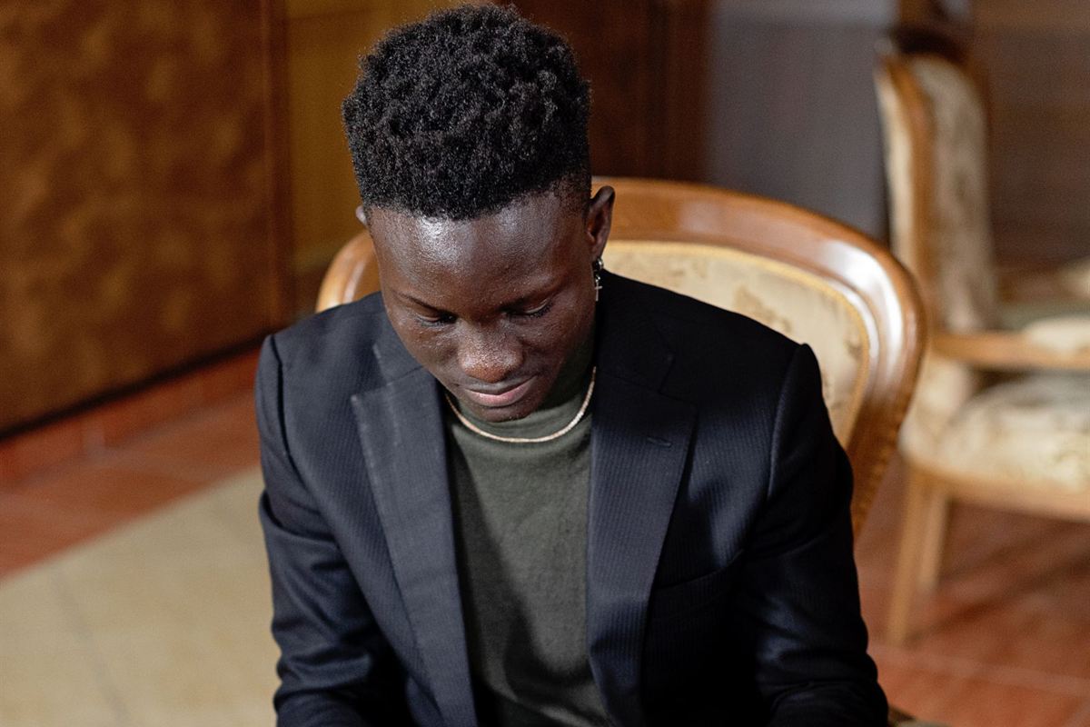 African businessman in a blazer reviewing documents