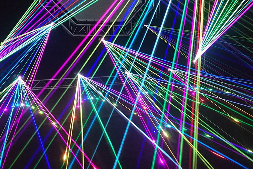 Coloured light beams fanning out like network connections