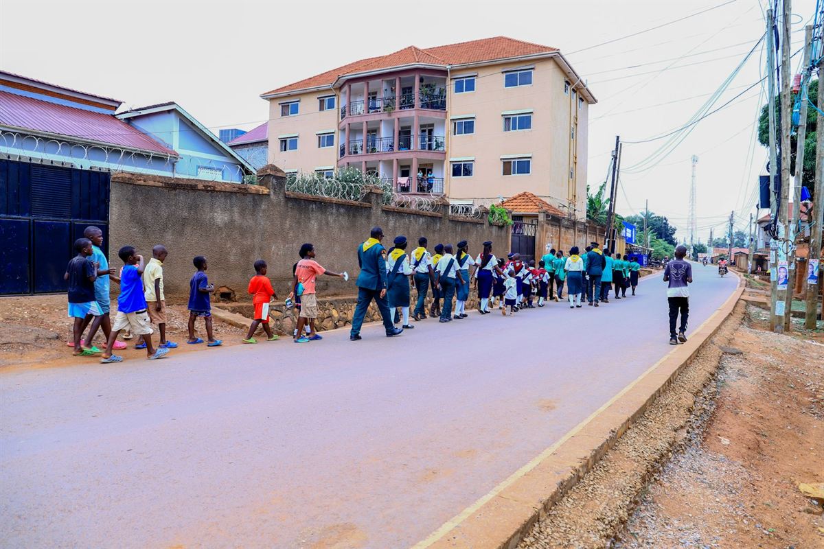 Schoolchildren walking along a street in Kampala