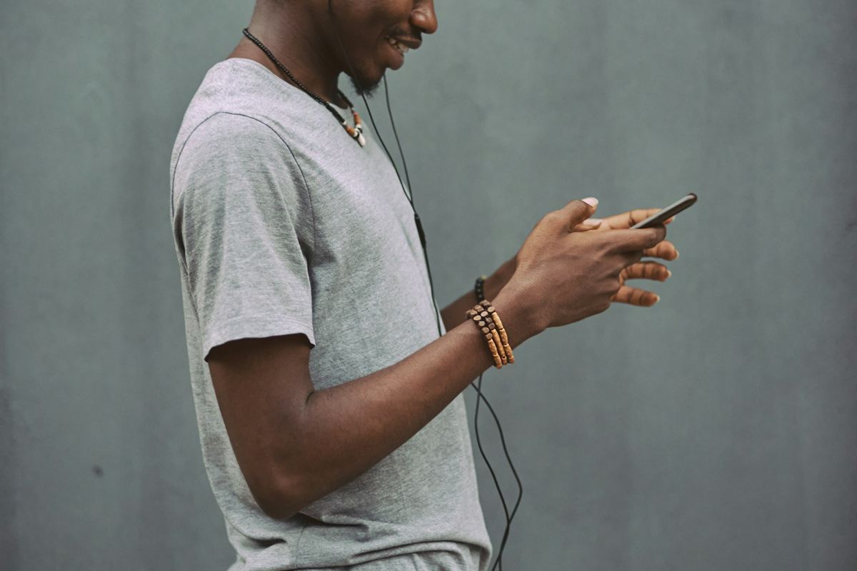 Man using a smartphone outdoors